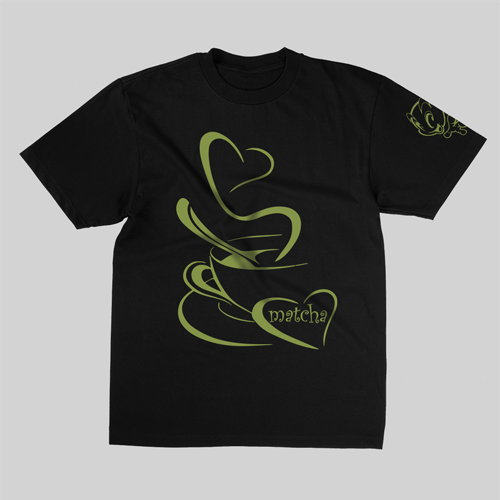 Black t-shirt with a hand-illustrated heart-shaped matcha latte design on the front, featuring creamy green tones and latte art details.