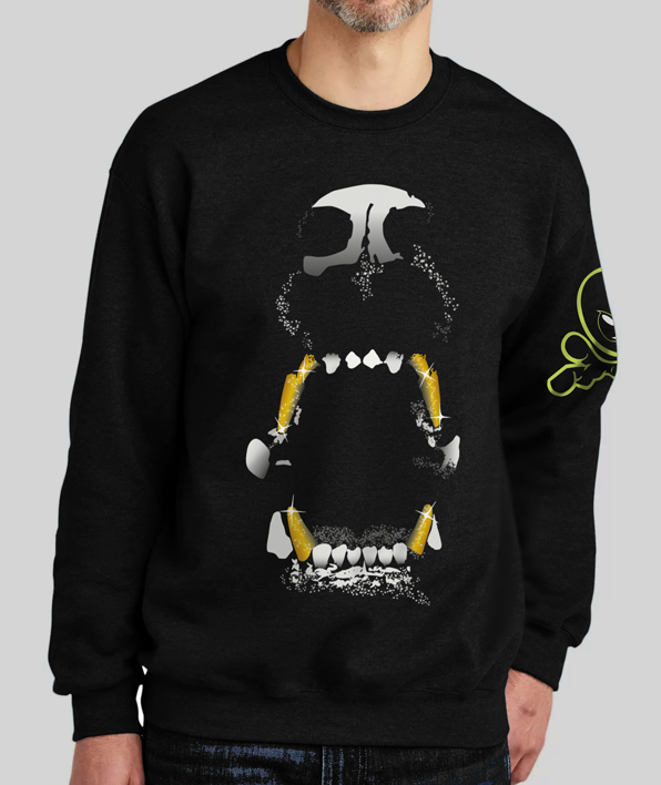 A man wearing a black sweatshirt featuring a hand-illustrated design of an aggressive dog baring its teeth, with gold fangs highlighted for a bold, edgy look.