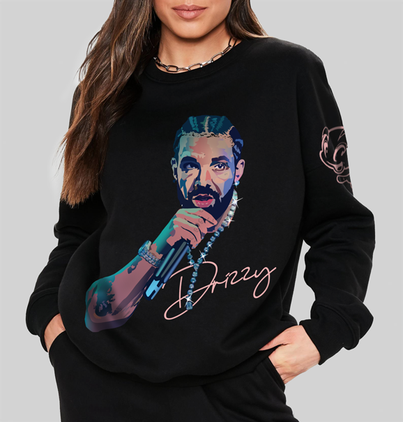 A woman wearing a black sweatshirt with a hand-illustrated design of Drake on the front, capturing his iconic expression and style in a bold, artistic rendition.