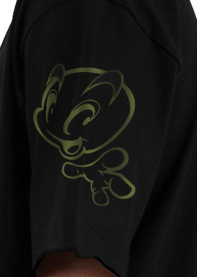 A close-up view of a black t-shirt featuring a minimalistic green character design on the side sleeve.